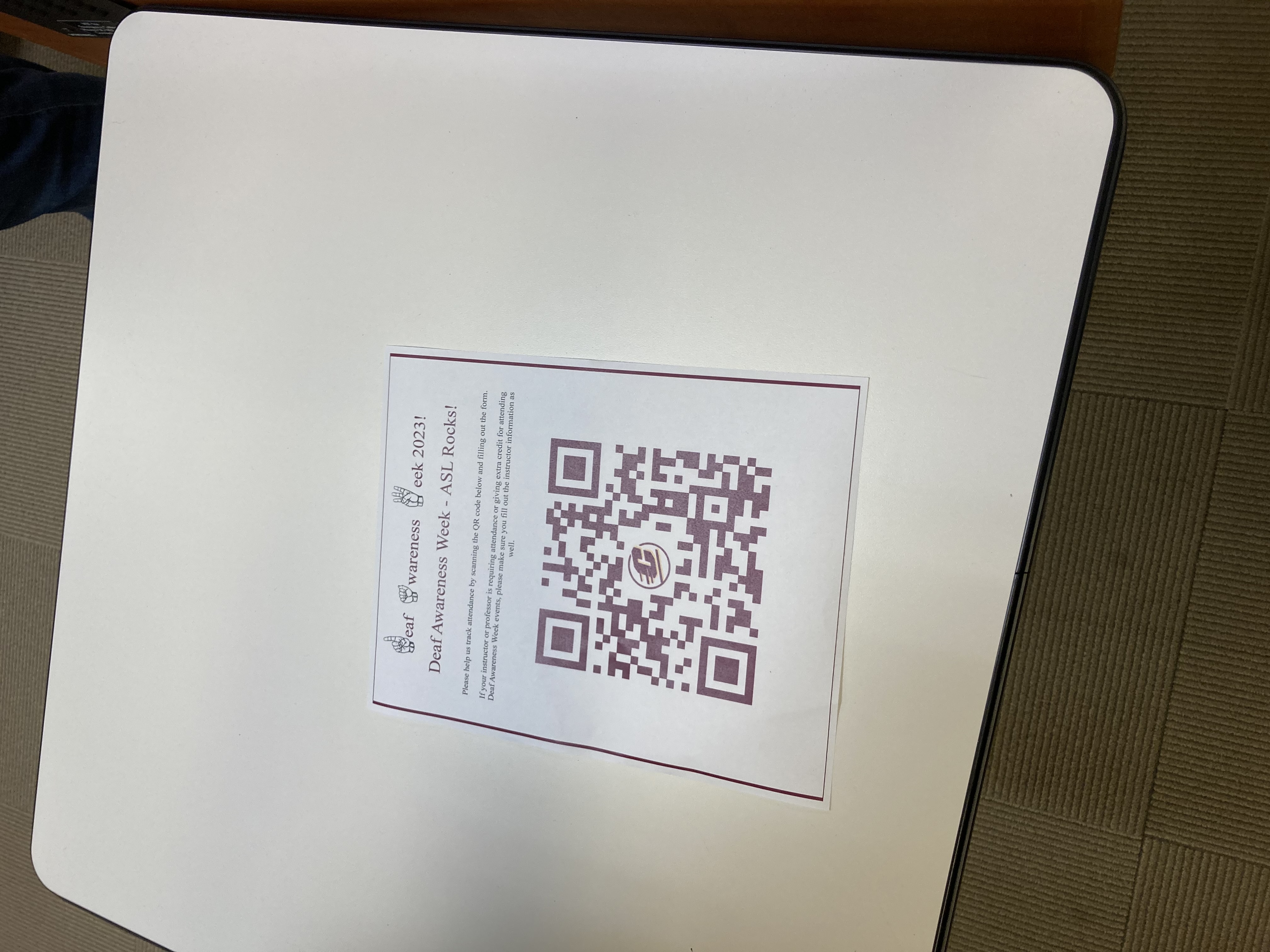 Picture of ASL Event flyer which reads: Deaf Awareness Week ASL Rocks Please help us track attendance by scanning the QR code below and filling out the form If your professor is requiring attendance or giving out extra credit for attending Deaf Awareness Week Events please make sure you fill out the instructor information as well